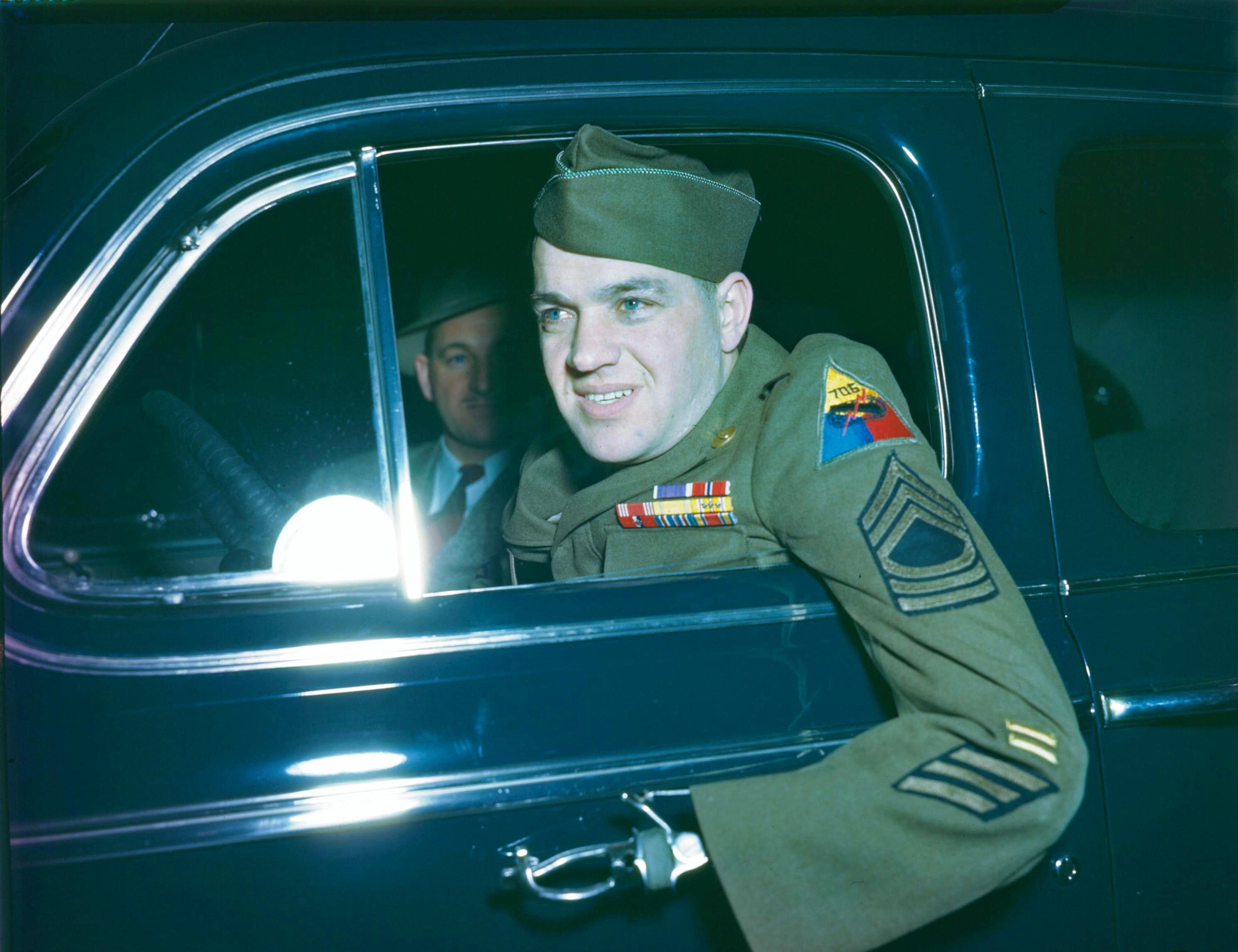 DAV member Sergeant Hensel in a Ford vehicle in 1946